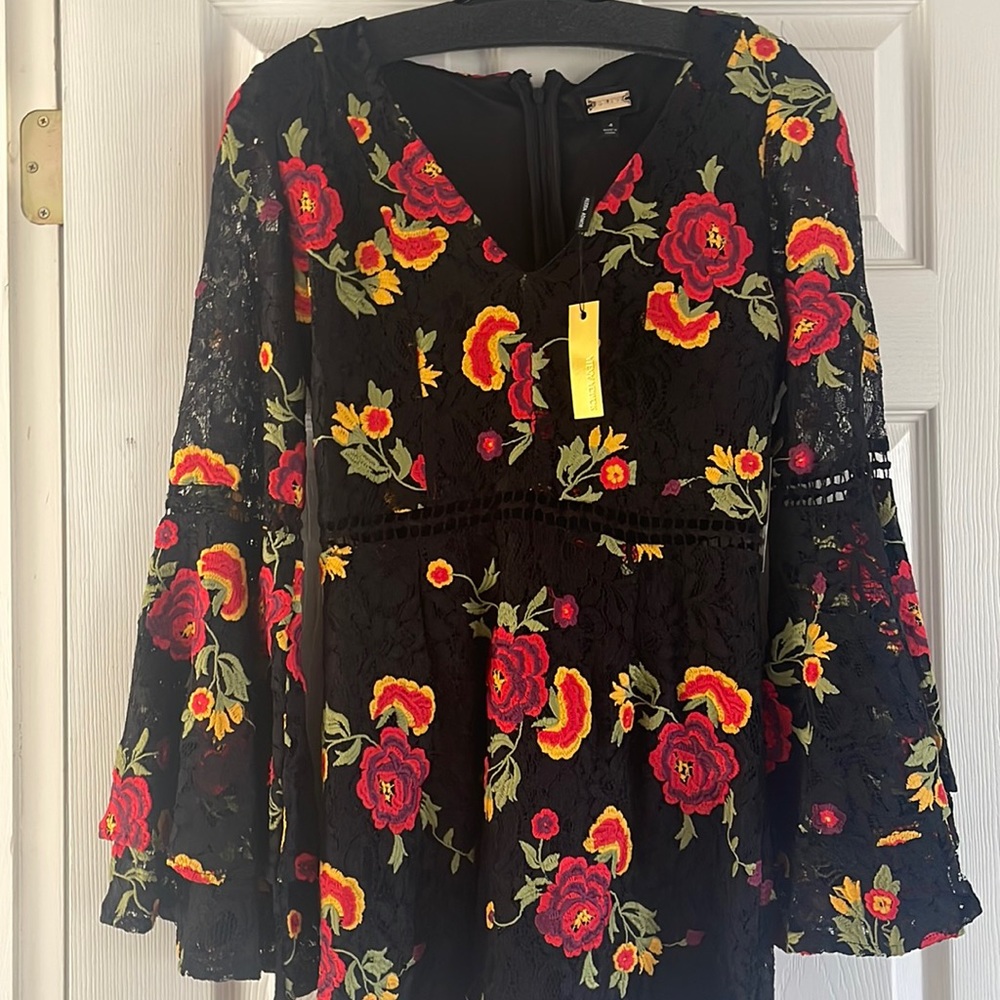 Fun black with beautiful embroidered flowers and bell sleeves